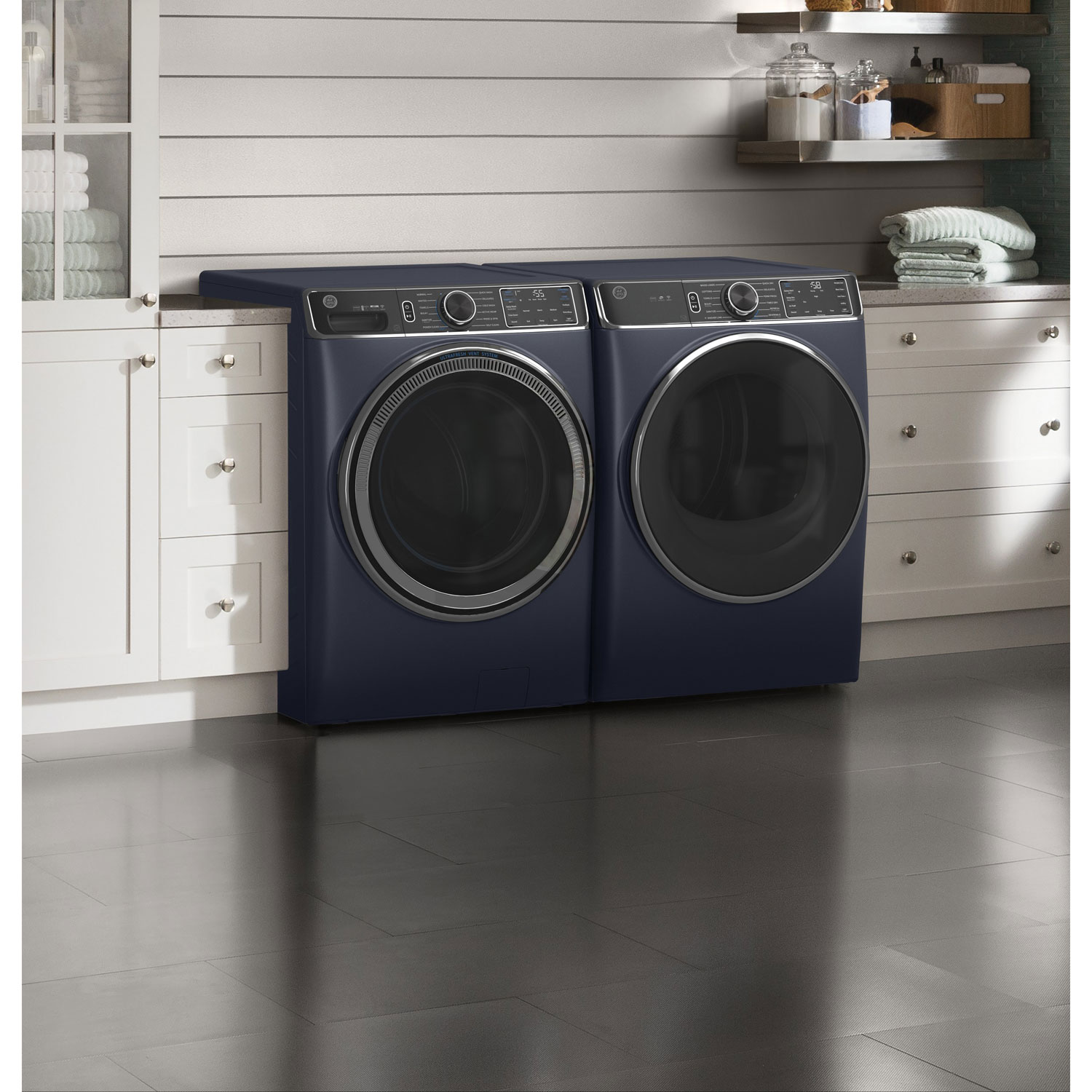 Sapphire blue GE laundry pair installed in a home laundry room