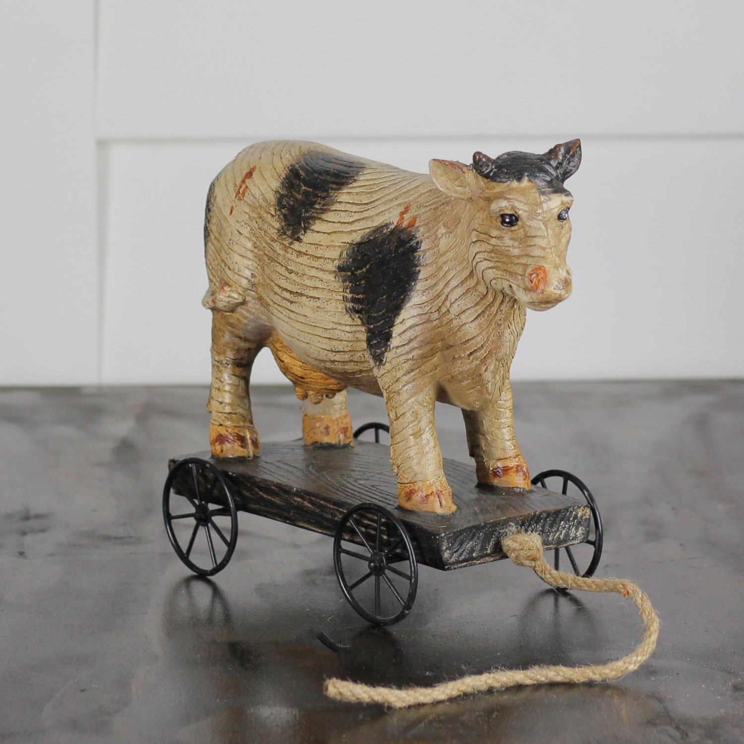 10.25" Black and White Wood Textured Cow on Cart Outdoor Garden Statue