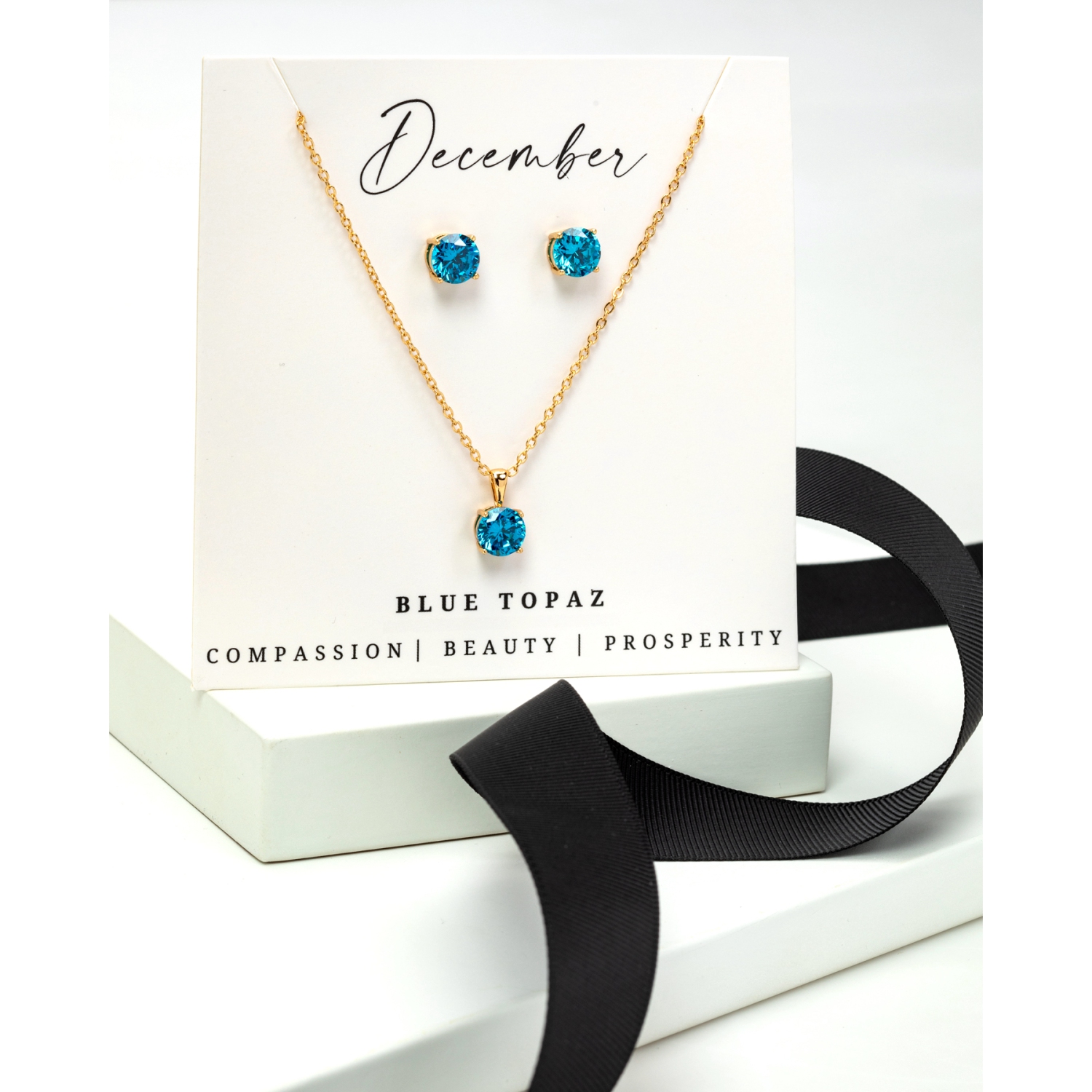 Boucles d'oreilles et collier, or, topaze bleue et zircons cubiques et pierre de naissance, ton or