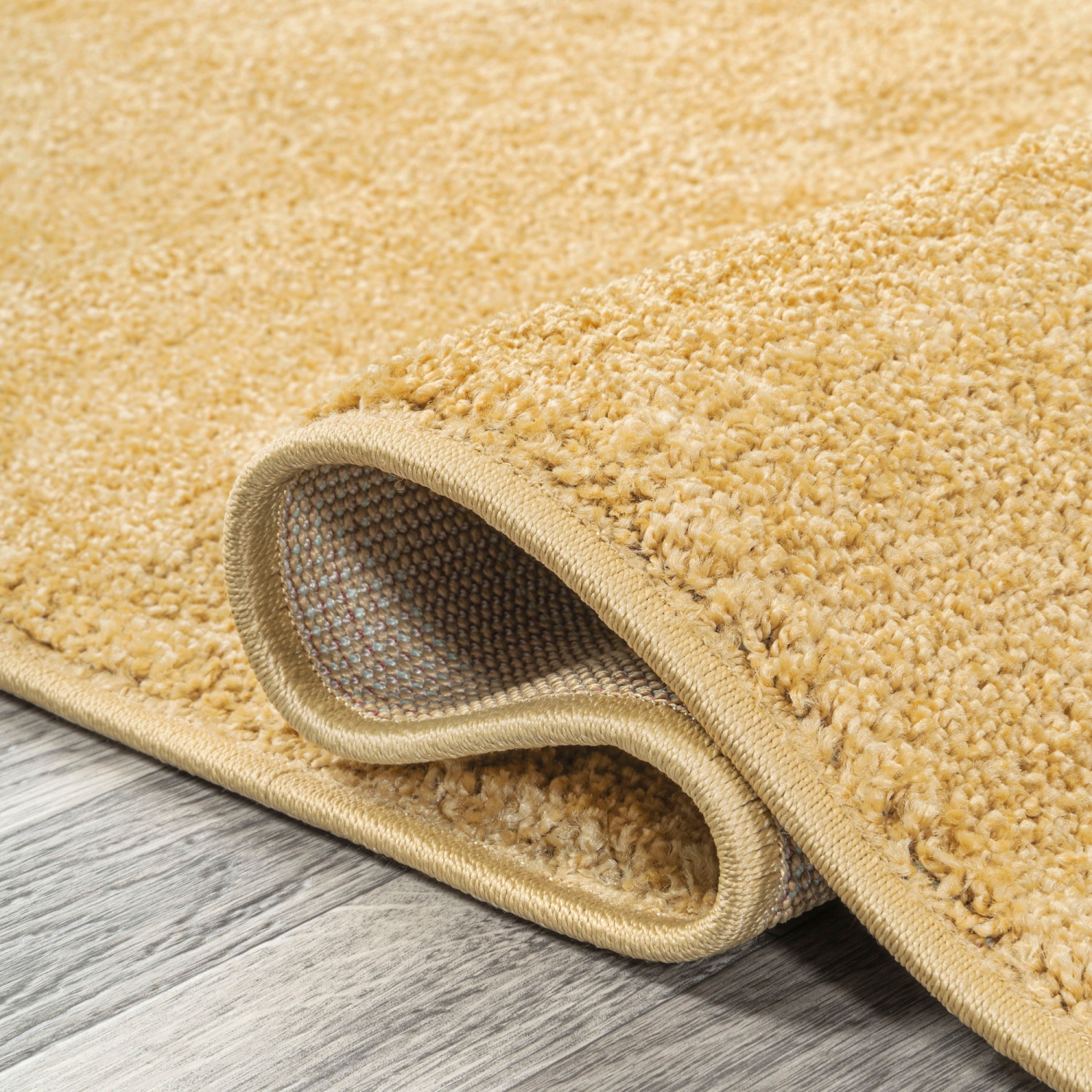 Haze Solid Low Pile Area Rug Mustard