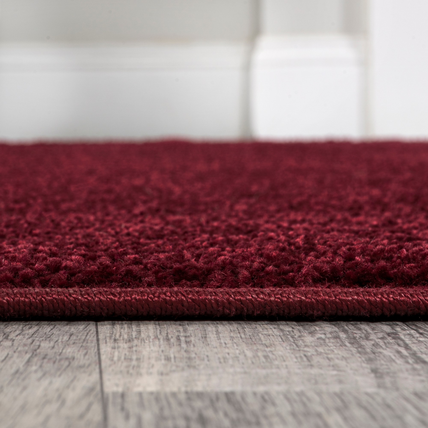 Haze Solid Low Pile Area Rug Dark Red