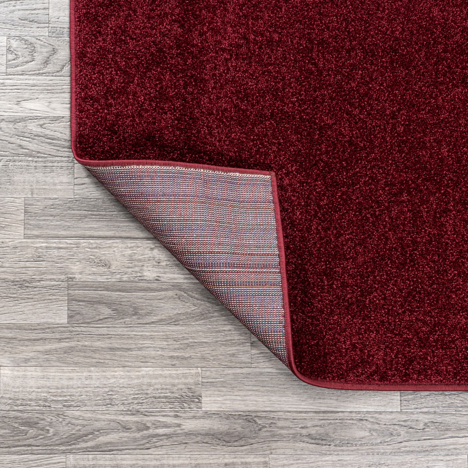Haze Solid Low Pile Area Rug Dark Red