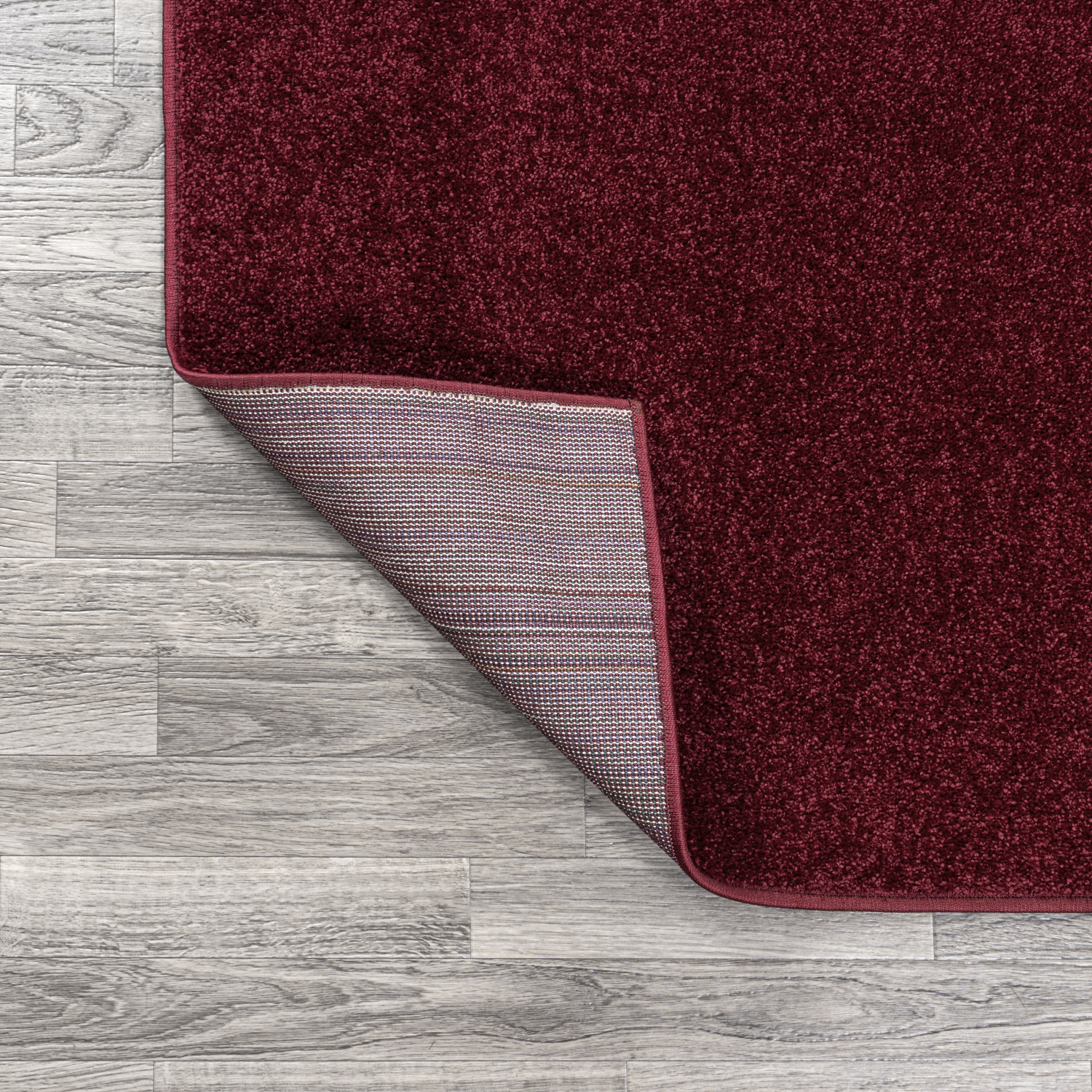 Haze Solid Low Pile Area Rug Dark Red