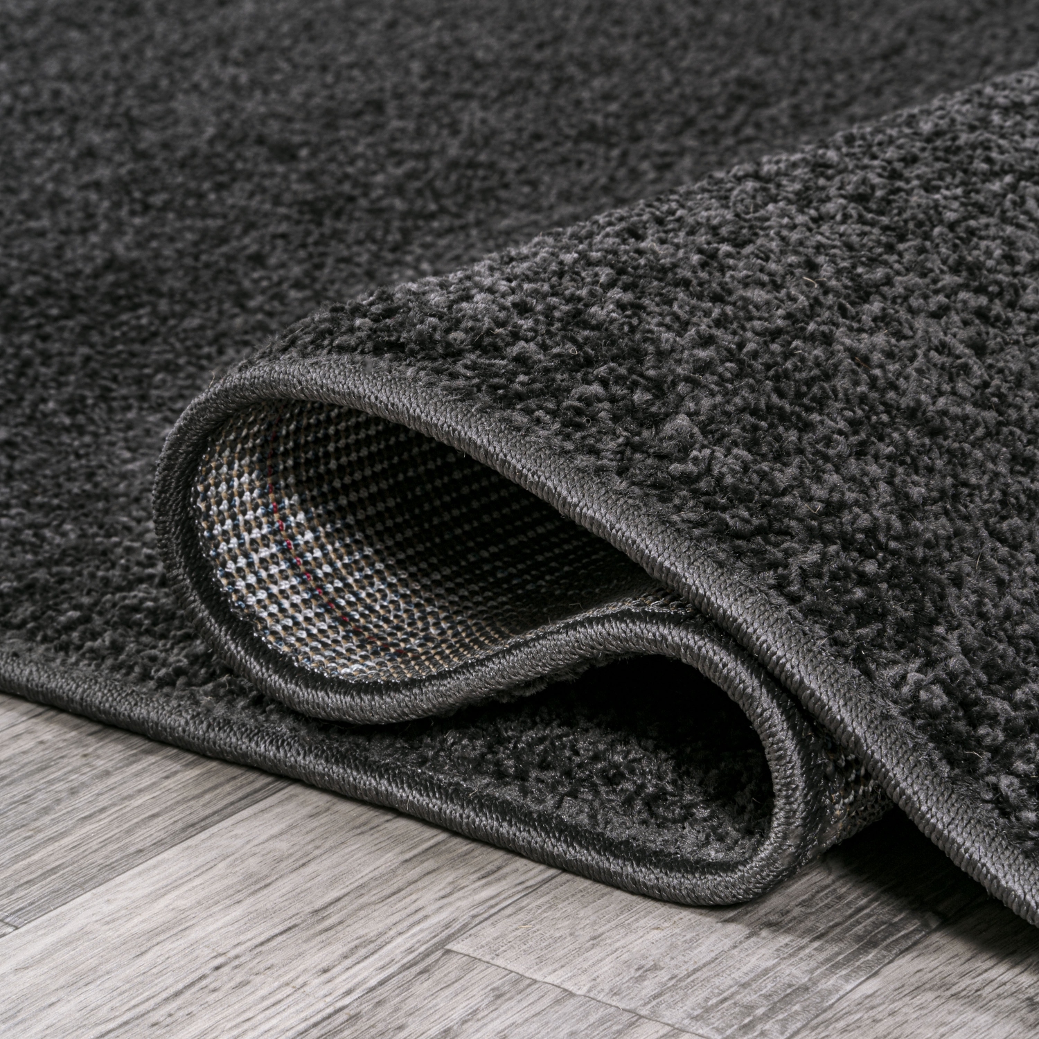 Haze Solid Low Pile Area Rug Black
