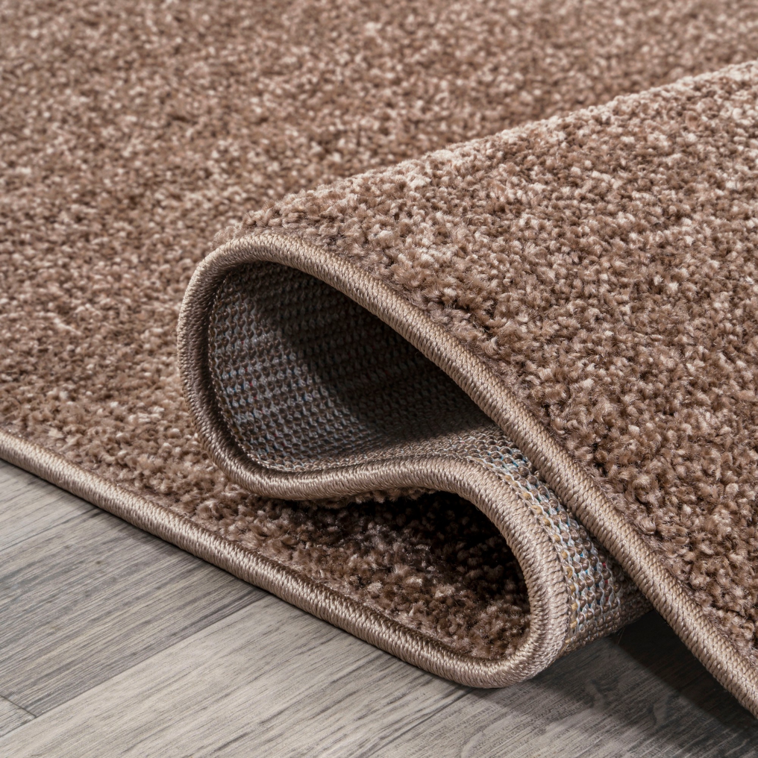 Haze Solid Low Pile Area Rug Brown