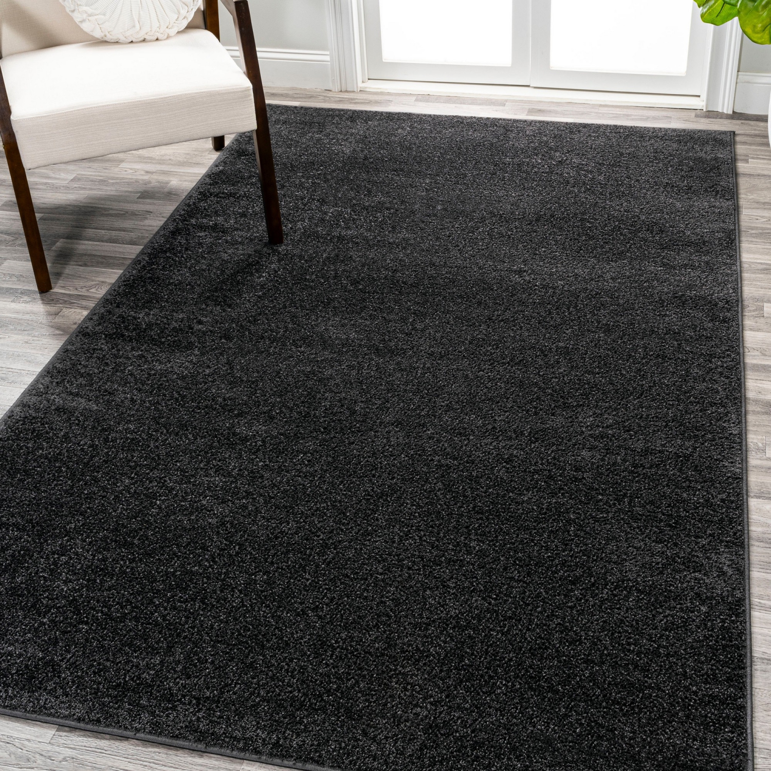 Haze Solid Low Pile Area Rug Black