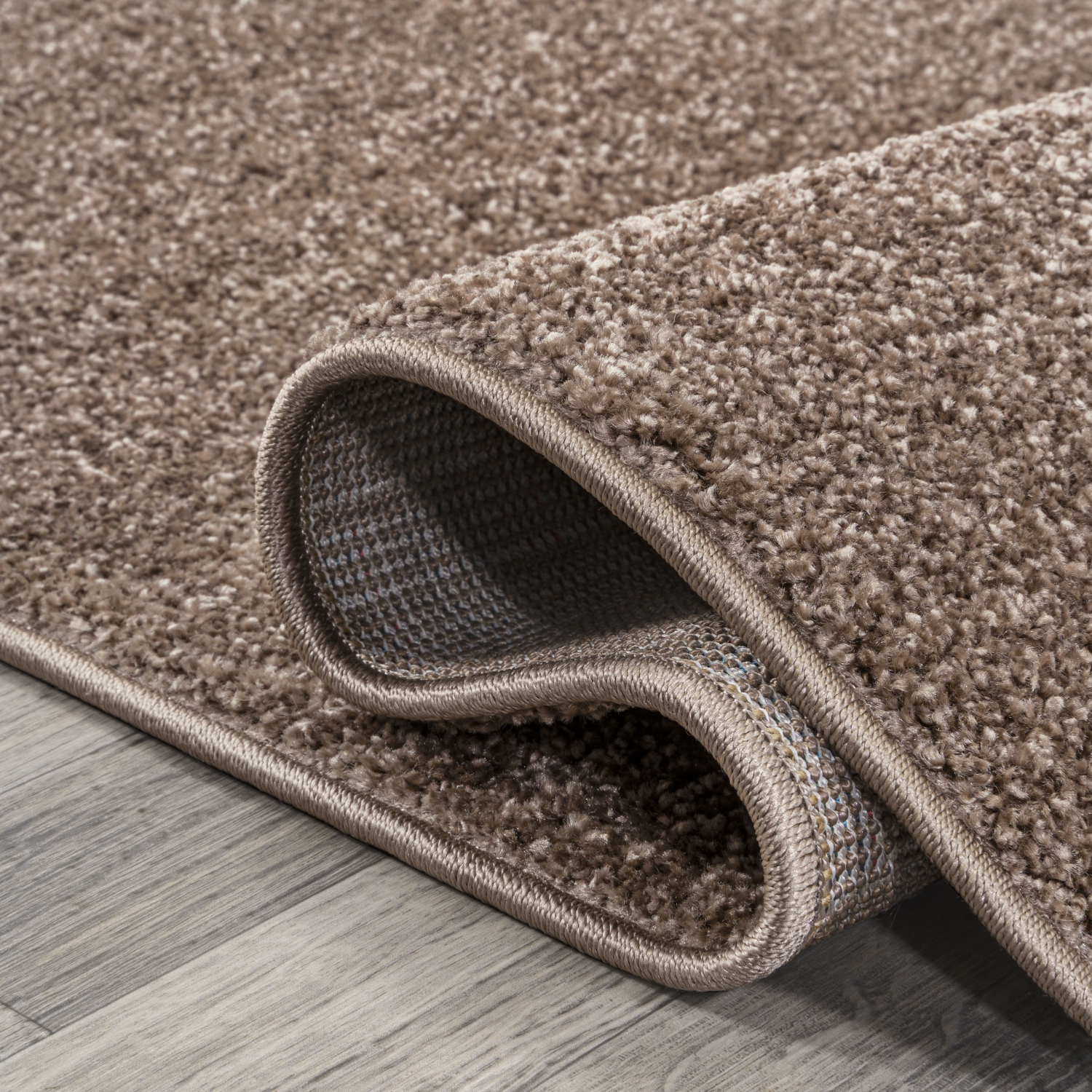 Haze Solid Low Pile Area Rug Brown