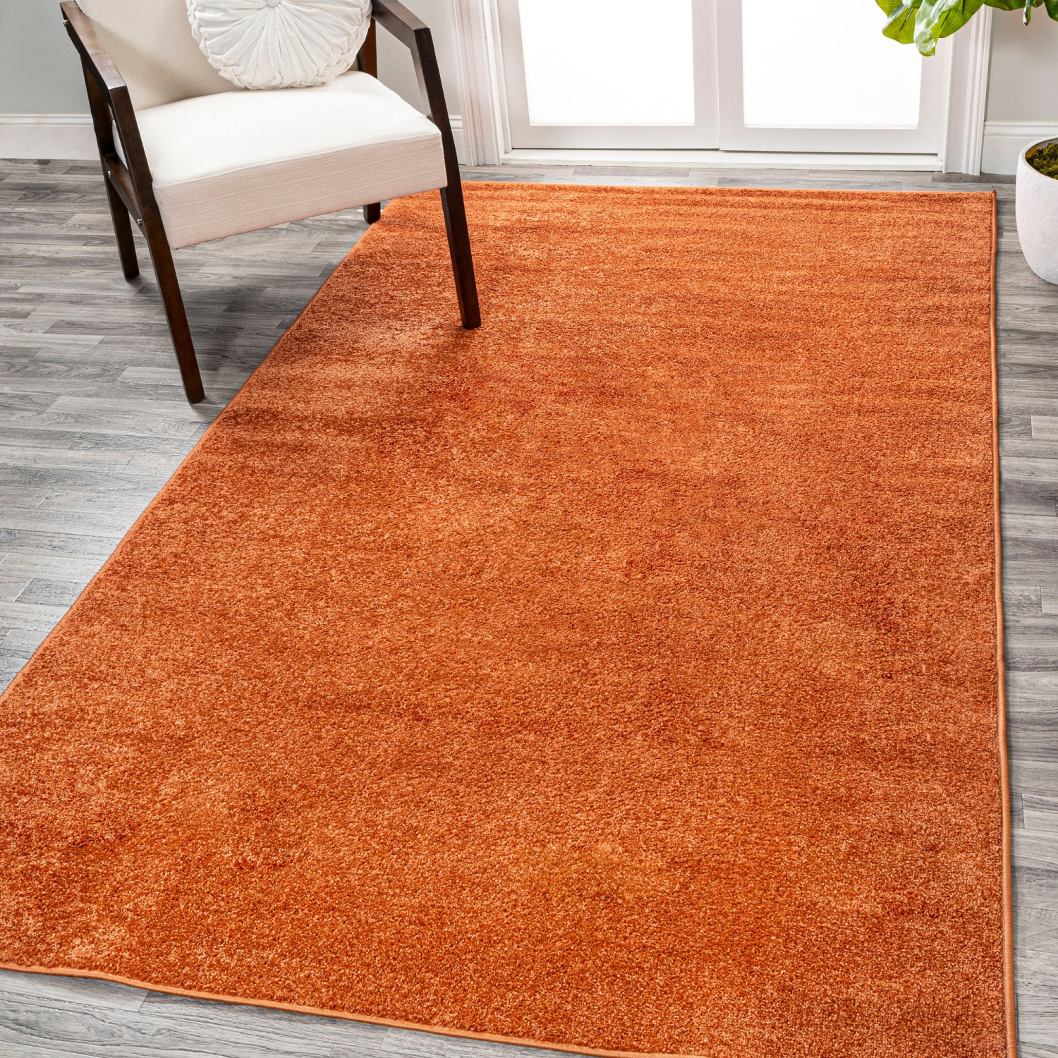 Haze Solid Low Pile Area Rug Orange