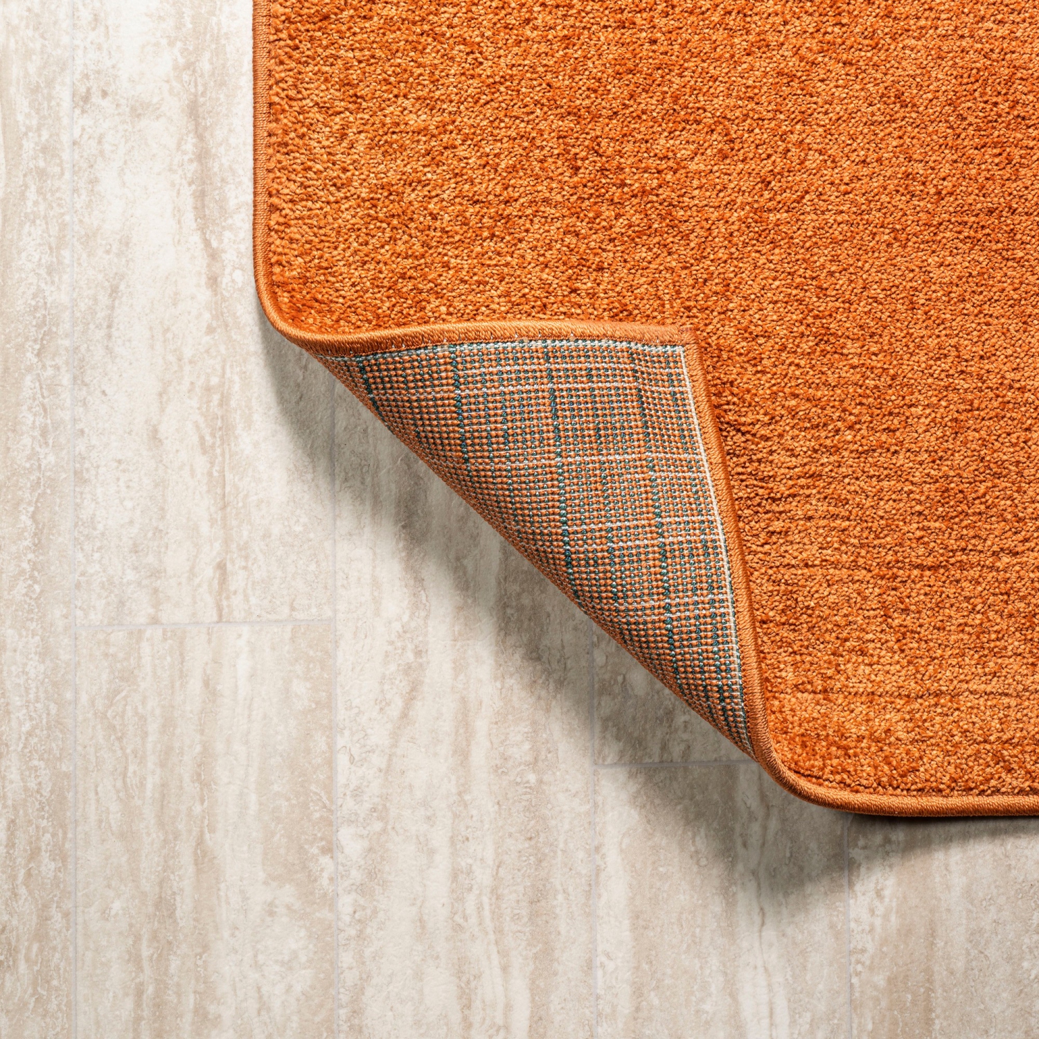 Haze Solid Low Pile Area Rug Orange