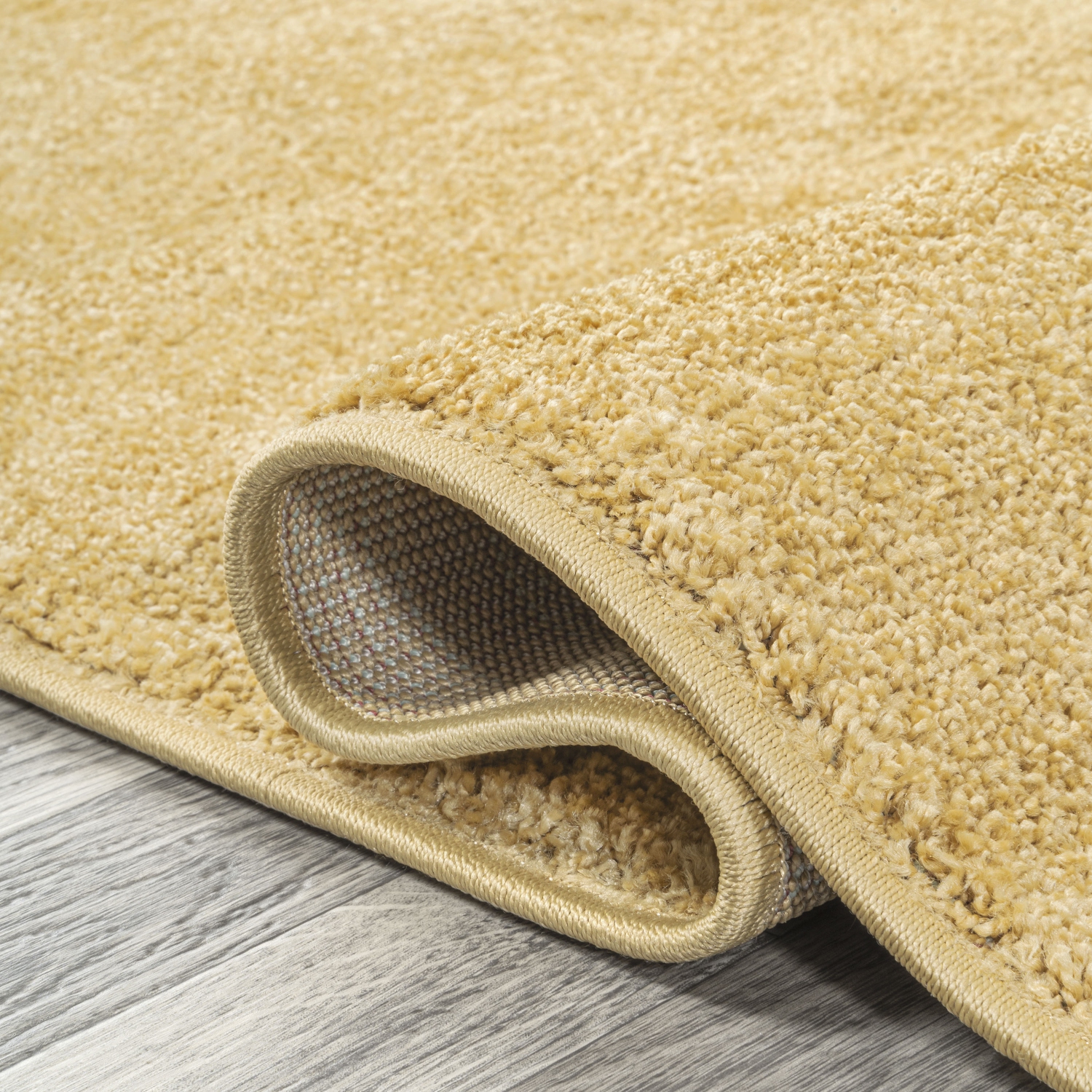 Haze Solid Low Pile Area Rug Mustard