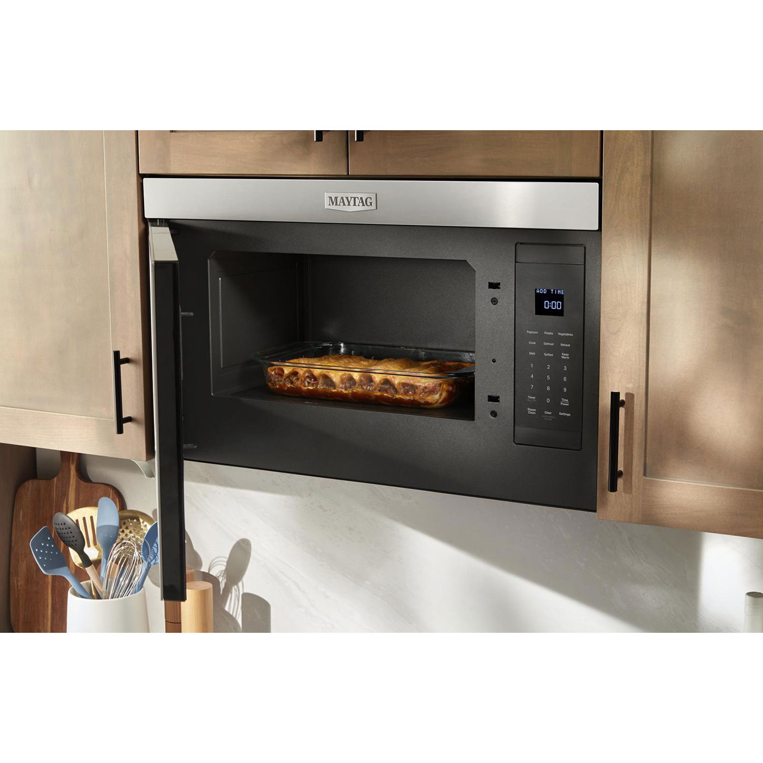 Micro-ondes avec hotte à design intégré sans plateau tournant de Maytag - 1,1 pi³ - Acier inoxydable