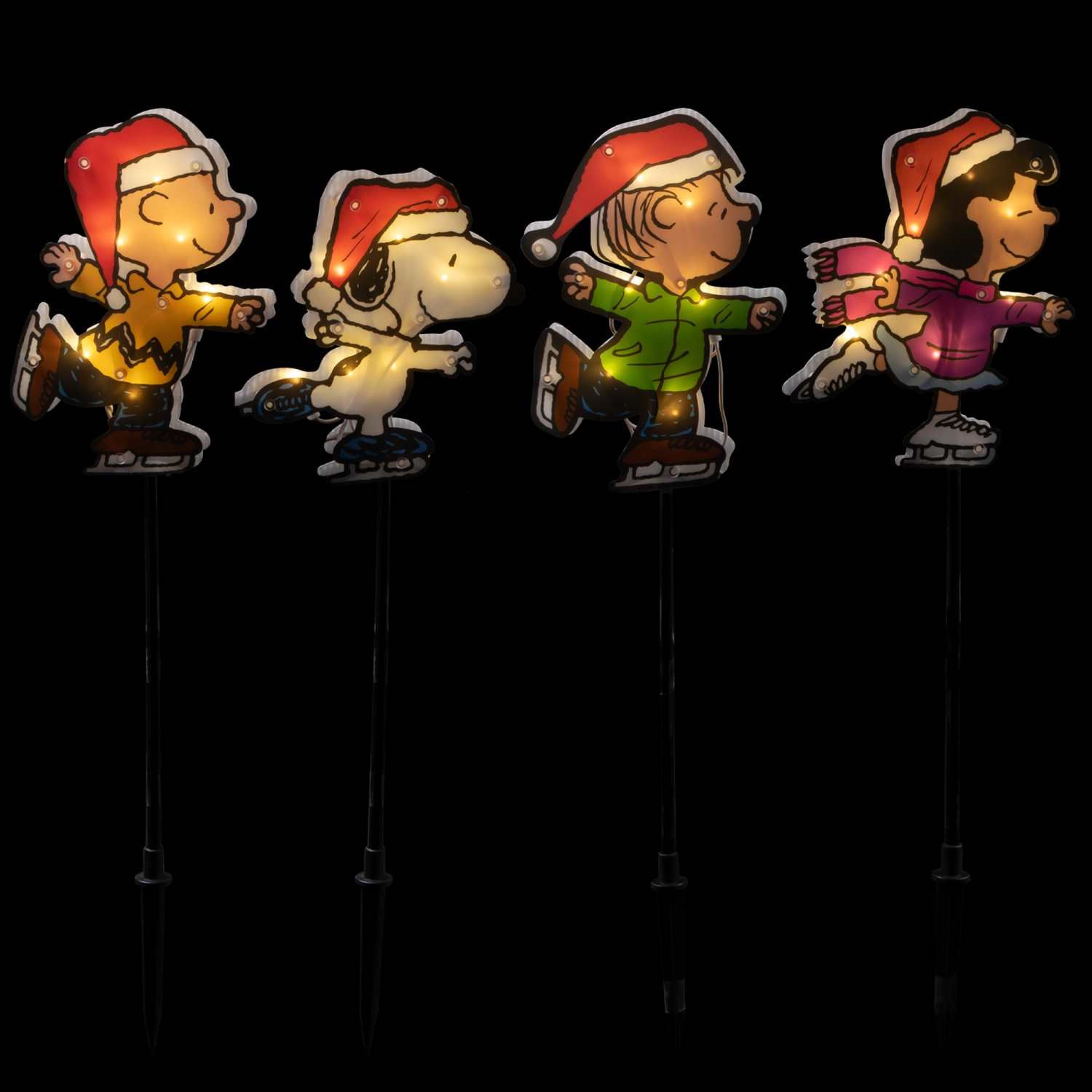 Marqueurs pour allée de Noël avec patinage sur glace Snoopy and Peanuts de Illuminé - Lumières transparentes - Ensemble de 4