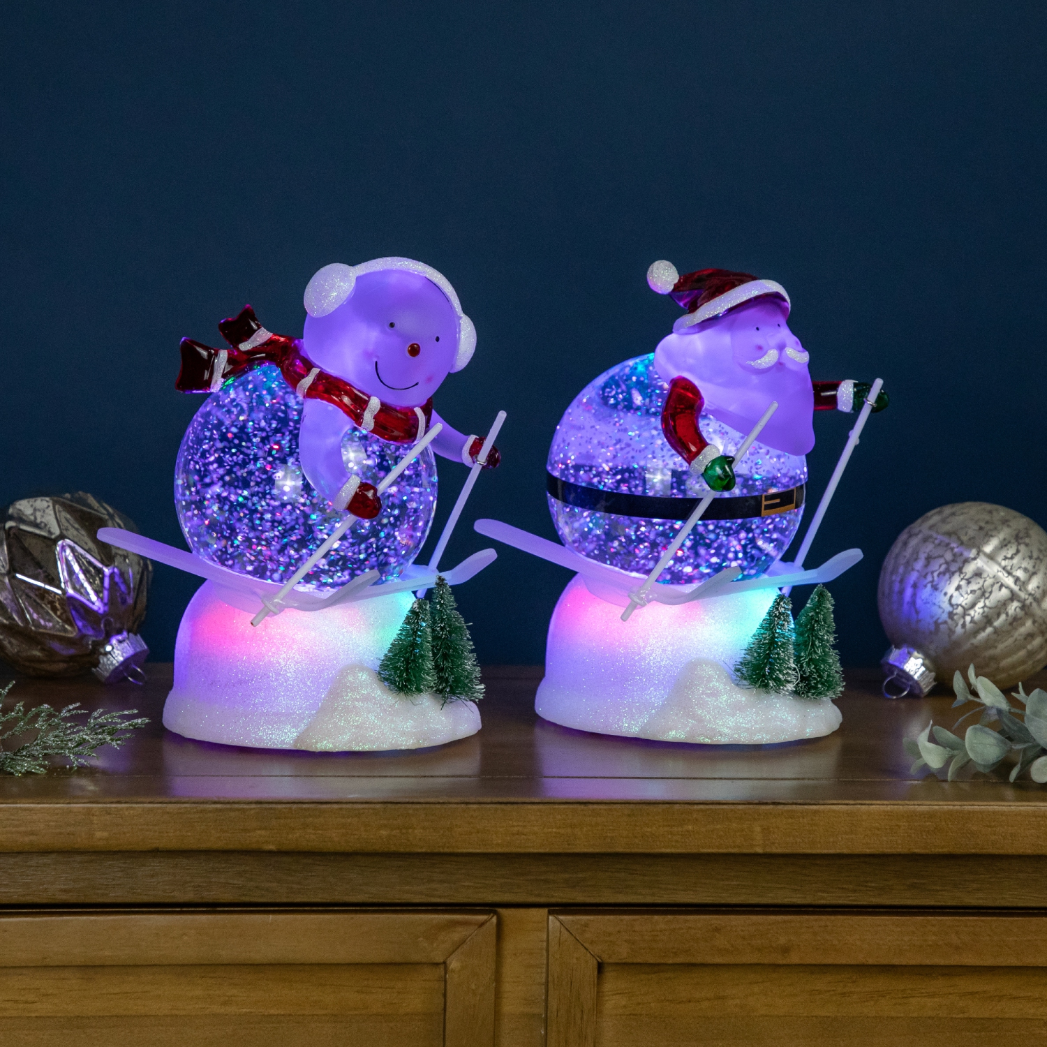 LED Lighted Color Changing Skiing Santa and Snowman Acrylic Christmas Snow Globes - 7.25" - Set of 2
