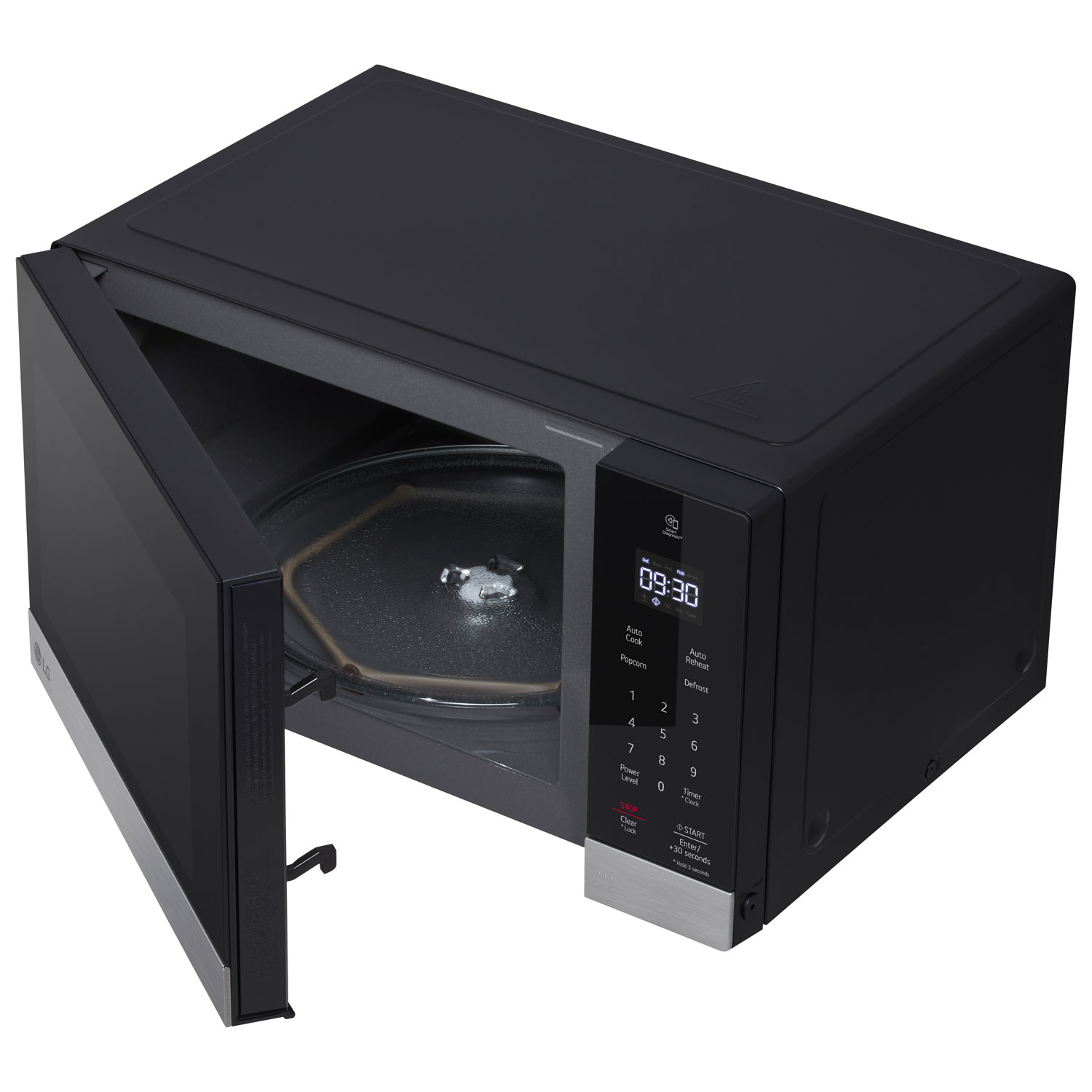 Top angle view of the microwave with door open showing the glass turntable