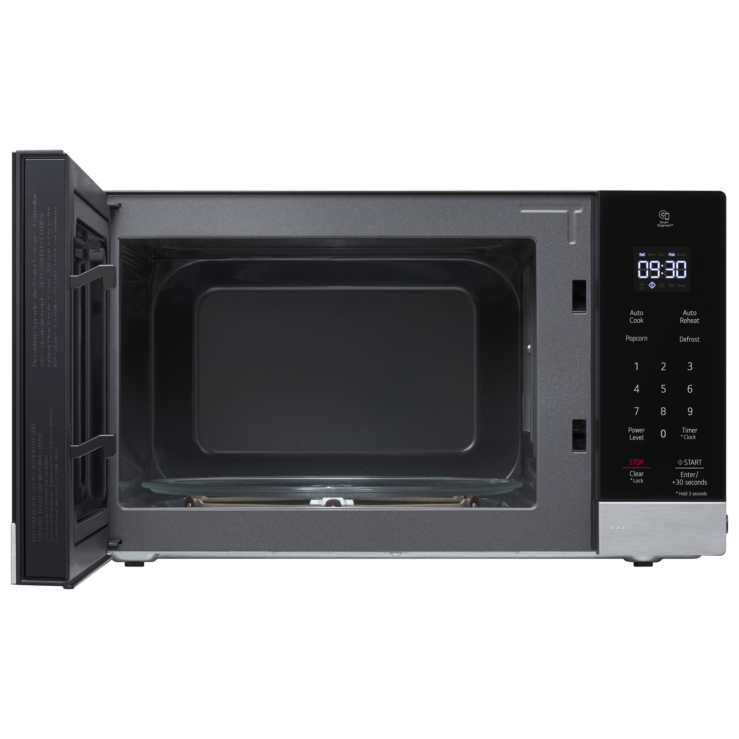 Microwave open with a bowl of vegetables inside on the glass turntable