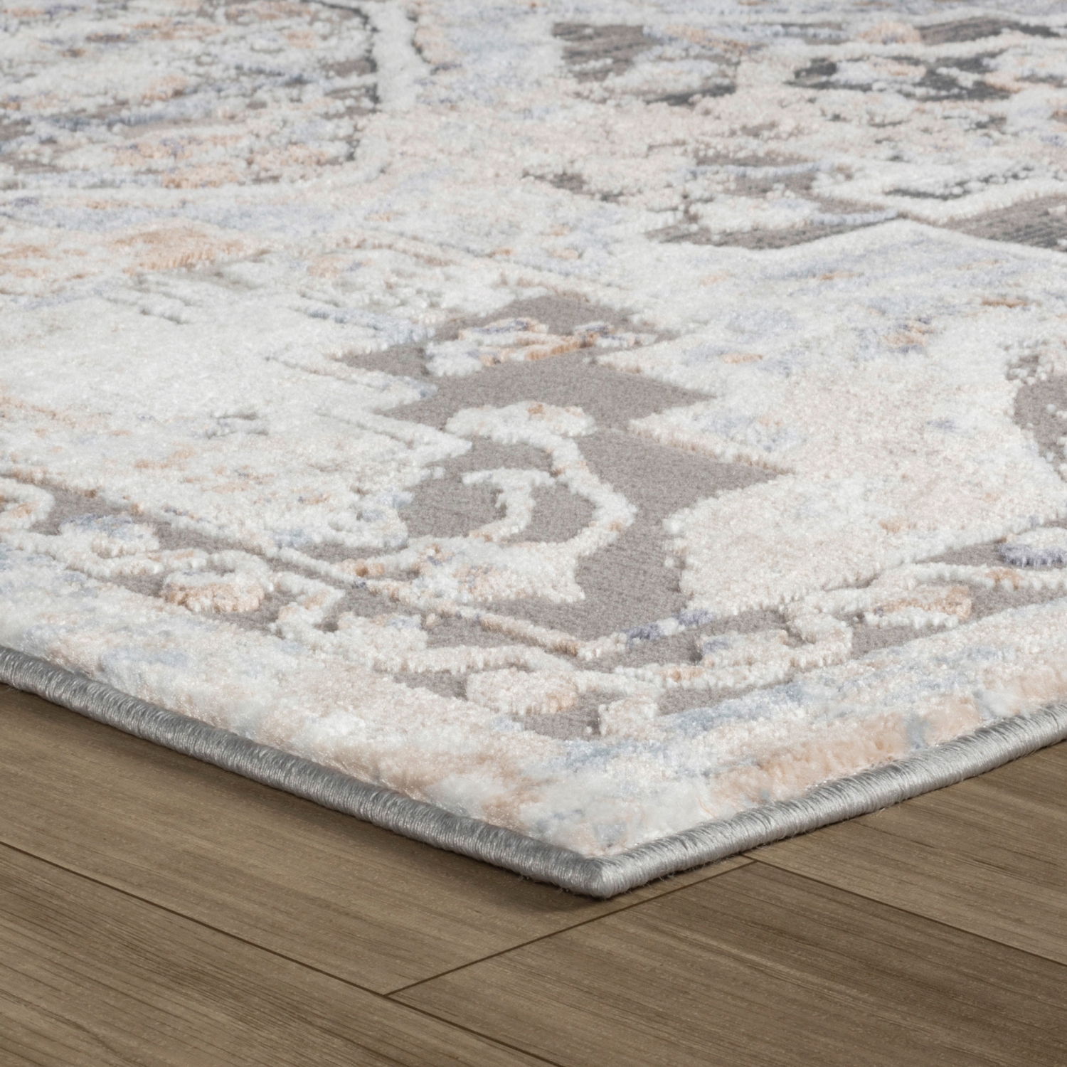 Tapis d'intérieur traditionnel à motif médaillon en losanges gris/beige Sukoon