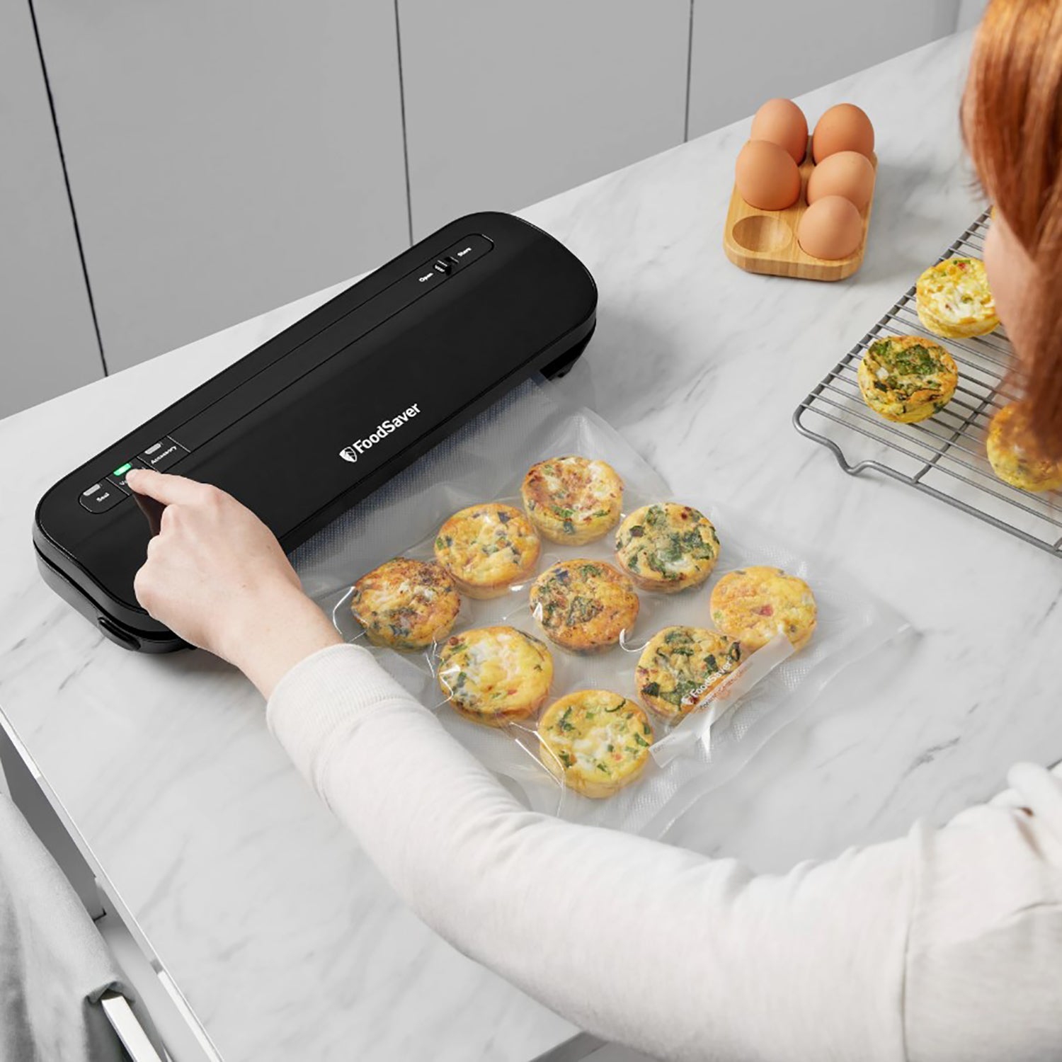 FoodSaver - Compact Vacuum Sealer Machine, Includes 1 Roll and 4 Pre-Cut Bags, Black