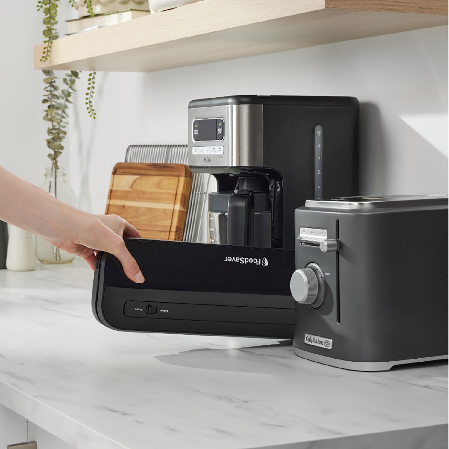 FoodSaver - Compact Vacuum Sealer Machine, Includes 1 Roll and 4 Pre-Cut Bags, Black