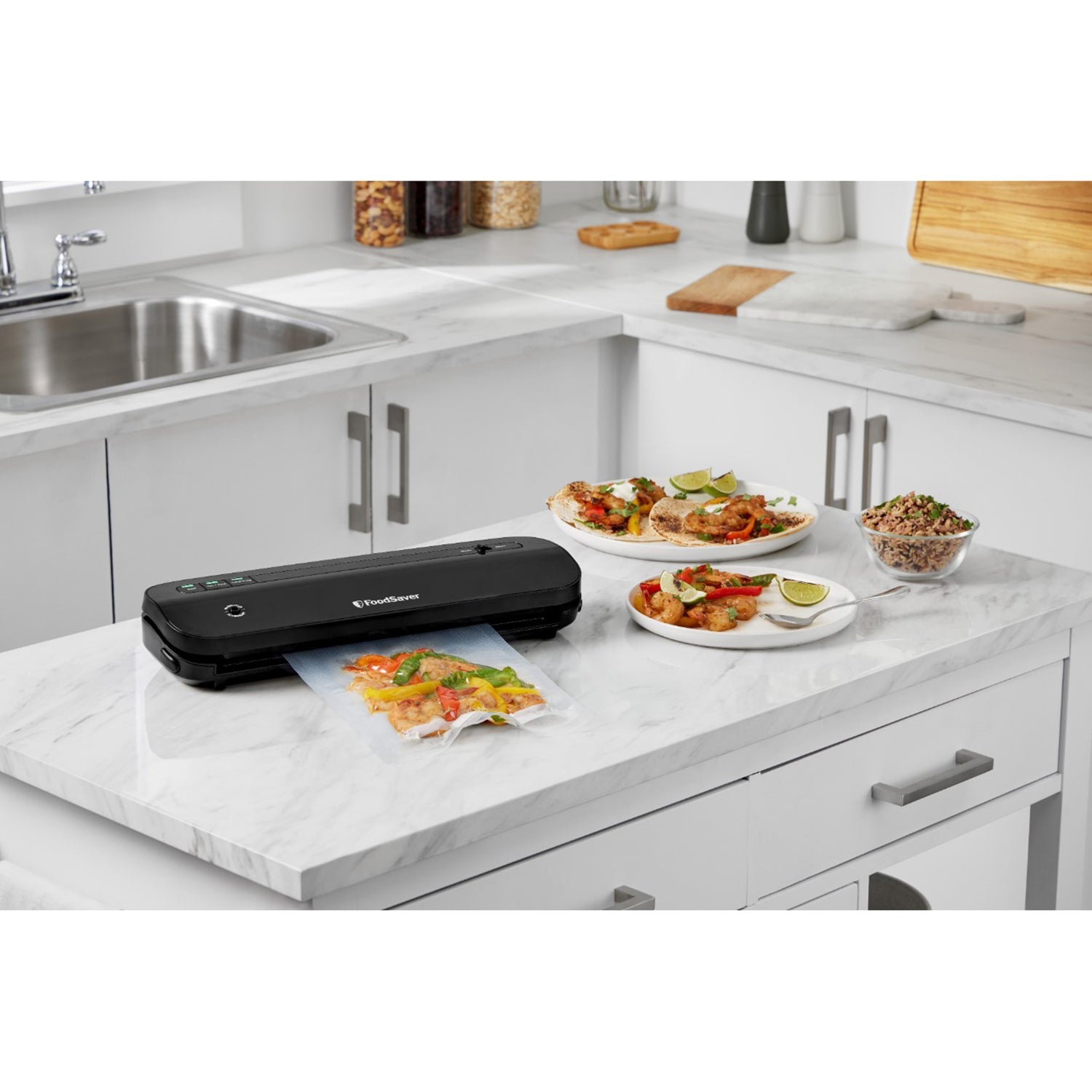 FoodSaver - Compact Vacuum Sealer Machine, Includes 1 Roll and 4 Pre-Cut Bags, Black