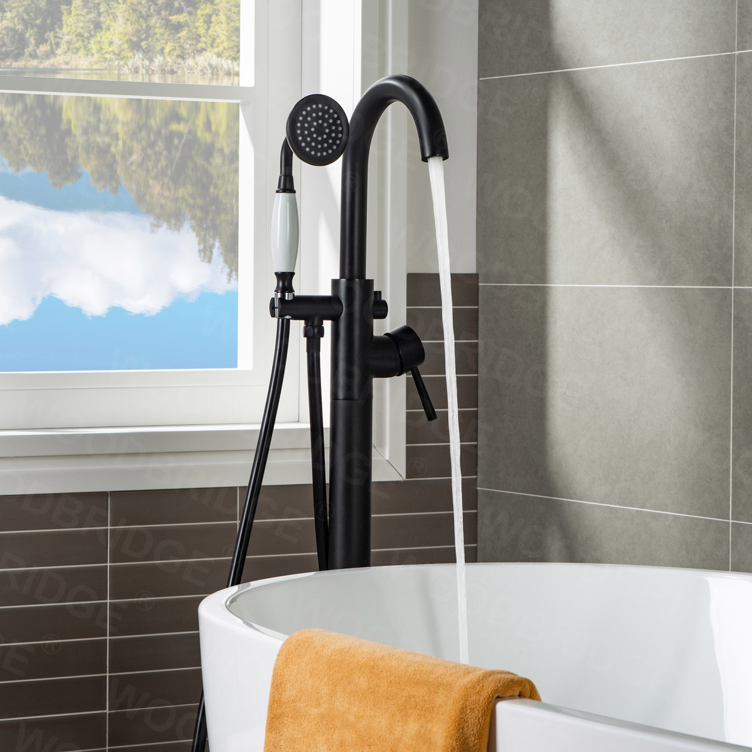 WOODBRIDGE Fusion Single Handle Floor Mount Freestanding Tub Filler Faucet with Telephone Hand shower in Matte Black Finish.