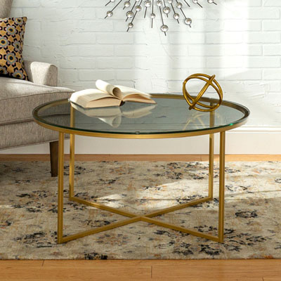 Contemporary Coffee Table with Tempered Safety Glass and X Base - Gold The table is actually a lighter shade of gold than in the picture (which I prefer), super easy to put together and it is the perfect height, I love it with my sectional