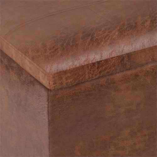 Simpli Home Rockwood Faux Air Leather Storage Ottoman in Distressed Saddle Brown