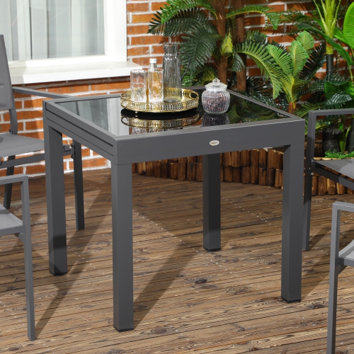 Outsunny Table de salle à manger d'extérieur extensible de 63 po avec cadre en aluminium et dessus de table en verre trempé, noir