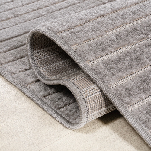 Tapis à motif géométrique courbé minimaliste de Skagen