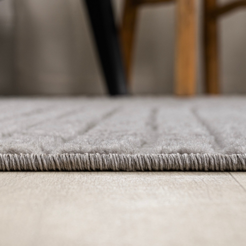 Tapis à motif géométrique courbé minimaliste de Skagen