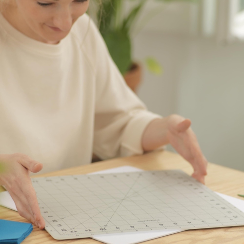 Fiskars Rotating Cutting Mat - 14" x 14" Grid to Cut Fabric Squares Easily - Perfect for Quilting, Sewing and Craft Proj
