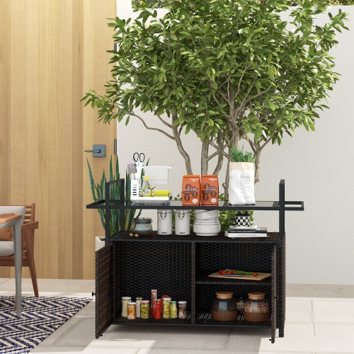 Outsunny PE Rattan Outdoor Bar Cart with Wheels, 2-Tier Outdoor Kitchen Island with Shelf & Cabinet, Rolling Cart with Glass Top, Handles, Towel