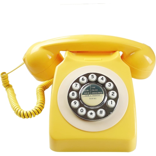 Old retro telephone office landline rotary dial hotel room landline - yellow