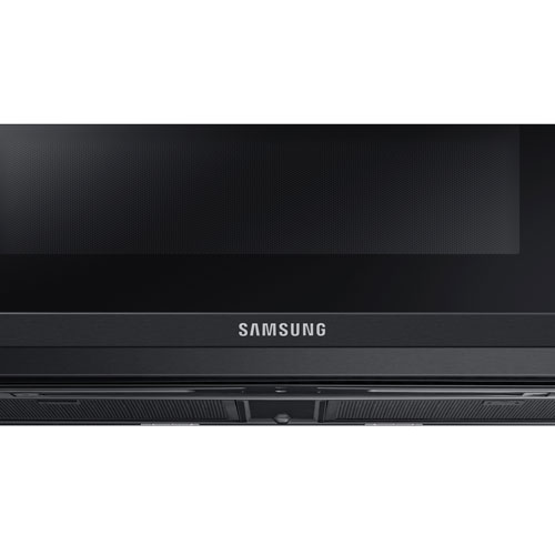 Four à micro-ondes à hotte intégrée de Samsung - 1,1 pi³ - Acier inoxydable noir