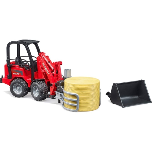 Schaeffer Compact loader 2630 with bale gripper and 1 round bale