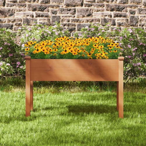 Jardin extérieur surélevé avec pattes et trous de drainage pour la plantation